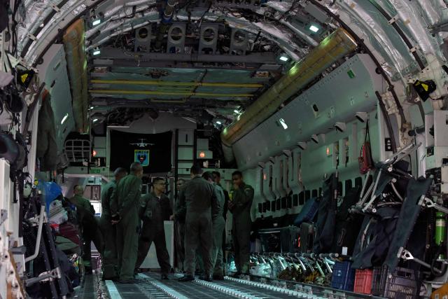 Brazilian firefighters, military personnel, and telecommunications technicians board a Brazilian Air Force plane for a humanitarian aid mission to Venezuela following deadly earthquakes, at Guarulhos air base in Guarulhos, Sao Paulo state, Brazil, on July 26 2026. Desperate Venezuelans raced to find and rescue loved ones trapped alive beneath the rubble of collapsed buildings after two major earthquakes, measured at magnitudes 7.2 and 7.5, hit northern Venezuela killing at least 235 people and leaving more than 1,500 injured. (Photo by NELSON ALMEIDA / AFP)
