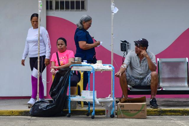 Rescue workers and paramedic set up an improvised care center in Moron, state of Carabobo, Venezuela, on June 26, 2026, following deadly earthquakes. Using heavy equipment or their bare hands, rescuers and volunteers searched for survivors of the twin earthquake in Venezuela, which has officially left 589 dead and, according to estimates, thousands missing. (Photo by Orlando Obispo / AFP)