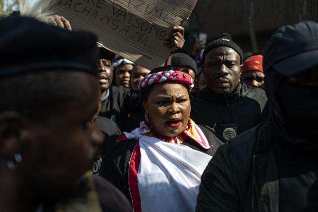 TOPSHOT - Demonstrators gather during a protest march by members of the Tsonga and Shangaan communities calling for their recognition as South Africans while protesting against xenophobia and tribalism, en route to the South African Human Rights Commission in Johannesburg on June 26, 2026. The demonstration was held ahead of June 30, a date promoted by anti-immigrant groups as a deadline for foreign nationals to leave South Africa, amid rising xenophobic rhetoric and fears of violence against migrants. (Photo by EMMANUEL CROSET / AFP)