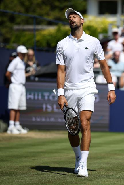Serbia's Novak Djokovic reacts to a lost point against US player Tommy Paul ahead of their men's singles match on day four of the Giorgio Armani Tennis Classic tournament at the Hurlingham Club in London on June 26, 2026. (Photo by Henry NICHOLLS / AFP)