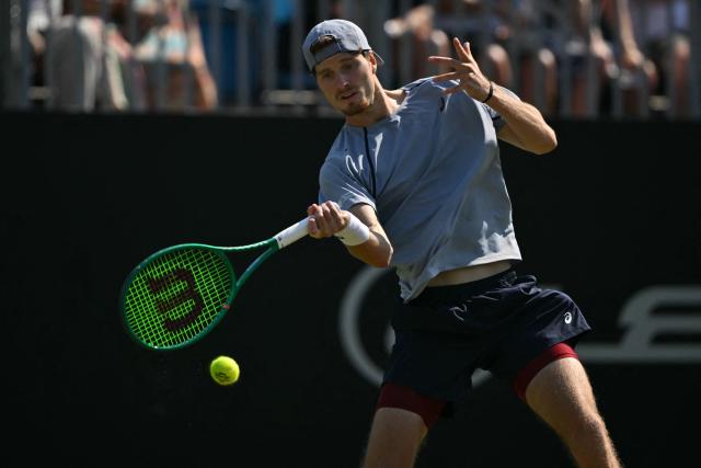 Britain's Toby Samuel returns to Belgium's Zizou Bergs during their men's semi-final tennis match on day five of the Lexus Eastbourne Open at Devonshire Park, Eastbourne, on the south coast of England on June 26, 2026. (Photo by Glyn KIRK / AFP)
