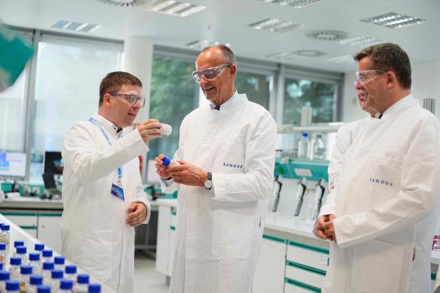 German Chancellor Friedrich Merz (C) visits pharmaceutical company Salutas Pharma with Saxony-Anhalt's State Premier Sven Schulze (R) in Barleben, near Magdeburg, eastern Germany on June 26, 2026. (Photo by Matthias Schrader / POOL / AFP)
