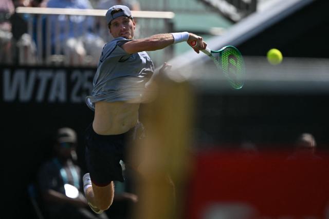 Britain's Toby Samuel returns to Belgium's Zizou Bergs during their men's semi-final tennis match on day five of the Lexus Eastbourne Open at Devonshire Park, Eastbourne, on the south coast of England on June 26, 2026. (Photo by Glyn KIRK / AFP)