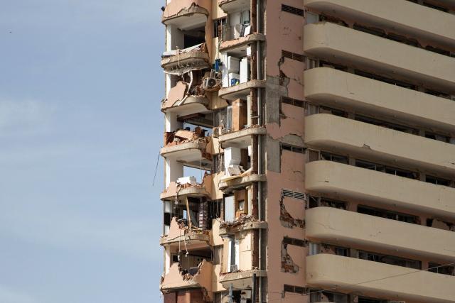 View of a building destroyed during twin earthquakes in Caraballeda, La Guaira State, some 40 km northeast of Caracas, on June 25, 2026. The death toll from twin earthquakes in Venezuela more than doubled on June 26, 2026, to 589, interim president Delcy Rodriguez said, as rescuers boosted by international teams raced to find survivors beneath collapsed buildings. Over 50,000 people are missing after the earthquakes in Venezuela, a senior UN official told AFP. (Photo by Donaldo BARROS / AFP)