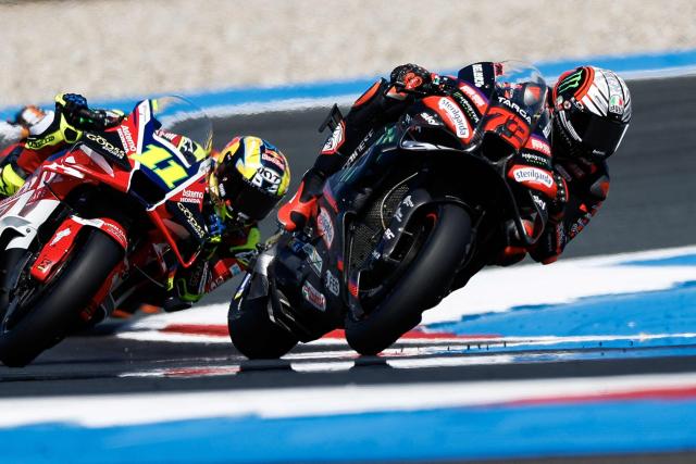 Aprilia Racing's Italian rider Marco Bezzecchi (R) accelerates out of a corner during a practice session ahead of the 95th edition of the Dutch Motorcycle Grand Prix at the TT Circuit Assen, in Assen, on June 26, 2026. (Photo by Vincent Jannink / ANP / AFP) / Netherlands OUT
