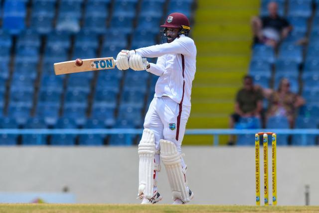 John Campbell of West Indies hits 4 during the second day of the first Test cricket match between West Indies and Sri Lanka at Sir Vivian Richards Stadium in North Sound, Antigua and Barbuda, on June 26, 2026. (Photo by Randy Brooks / AFP)
