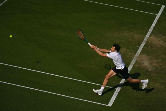 France's Ugo Humbert returns against Britain's Jack Draper during their men's semi-final tennis match on day five of the Lexus Eastbourne Open at Devonshire Park, Eastbourne, on the south coast of England on June 26, 2026. (Photo by Glyn KIRK / AFP)
