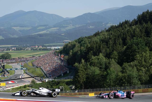 Cadillac's Mexican driver Sergio Perez (L) and Alpine's Argentine driver Franco Colapinto drive during the second practice session at the Red Bull Ring race track in Spielberg, Austria on June 26, 2026, ahead of the Formula One Austrian Grand Prix. (Photo by Joe KLAMAR / AFP)
