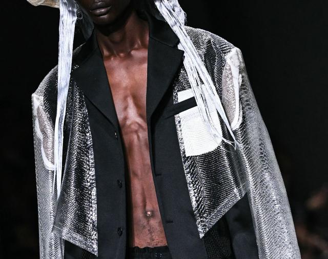 A model presents a creation for Comme des Garcons for the Menswear Spring/Summer 2027 collection fashion show as part of the Paris Fashion Week, in Paris on June 26, 2026. (Photo by JULIEN DE ROSA / AFP)