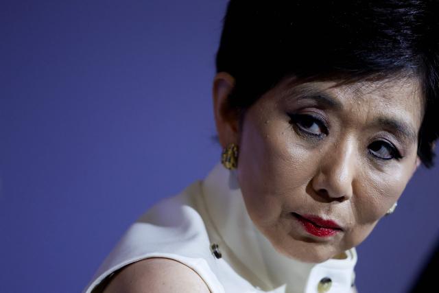 US businesswoman and President of Olympique Lyonnais Michele Kang looks on during a press conference at the Groupama Stadium in Decines-Charpieu near Lyon, central-eastern France, on June 26, 2026. The US businesswoman Michele Kang has become the majority shareholder of Olympique Lyonnais (Ligue 1), which she has been managing for the past year, according to Eagle Football Group, the club’s previous owner. (Photo by Alex MARTIN / AFP)
