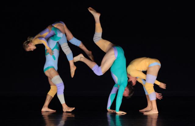 Dancers with Pilobolus, a modern dance and acrobatics company, perform a scene from "Virtuous and Vicious" during a dress rehearsal at the Joyce Theater in New York City on June 26, 2026. (Photo by TIMOTHY A. CLARY / AFP)