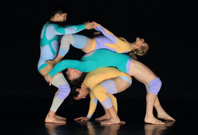 Dancers with Pilobolus, a modern dance and acrobatics company, perform a scene from "Virtuous and Vicious" during a dress rehearsal at the Joyce Theater in New York City on June 26, 2026. (Photo by TIMOTHY A. CLARY / AFP)