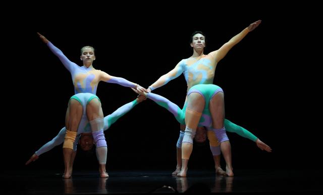 Dancers with Pilobolus, a modern dance and acrobatics company, perform a scene from "Virtuous and Vicious" during a dress rehearsal at the Joyce Theater in New York City on June 26, 2026. (Photo by TIMOTHY A. CLARY / AFP)
