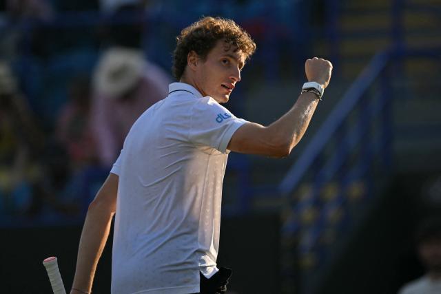 France's Ugo Humbert celebrates his win over Britain's Jack Draper in their men's semi-final tennis match on day five of the Lexus Eastbourne Open at Devonshire Park, Eastbourne, on the south coast of England on June 26, 2026. (Photo by Glyn KIRK / AFP)