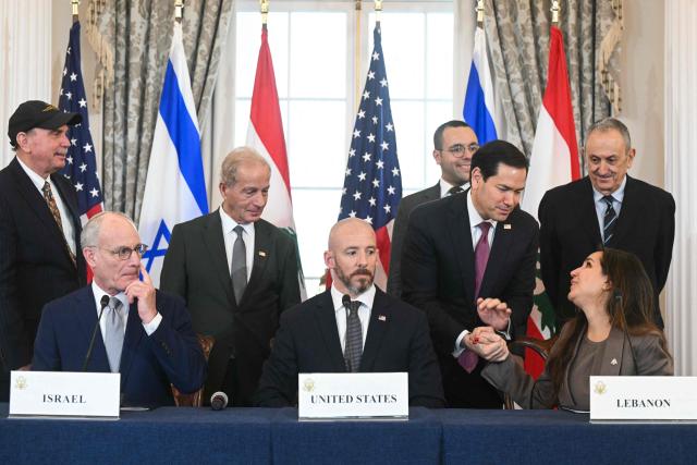US Secretary of State Marco Rubio shakes hands with Lebanese Ambassador to the US Nada Hamadeh (R, front) as Israeli Ambassador to the US Yechiel Leiter (L, front) and State Department Chief of Staff Daniel Holler (C, front) look on during a signing ceremony at the US Department of State in Washington, DC, on June 26, 2026. Lebanon, Israel and the United States on Friday signed a trilateral framework agreement aimed at paving the way for a peace deal between the two long-time Middle East adversaries. (Photo by SAUL LOEB / AFP)