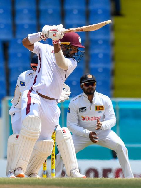 Amir Jangoo of West Indies hits 4 during the second day of the first Test cricket match between West Indies and Sri Lanka at Sir Vivian Richards Stadium in North Sound, Antigua and Barbuda, on June 26, 2026. (Photo by Randy Brooks / AFP)