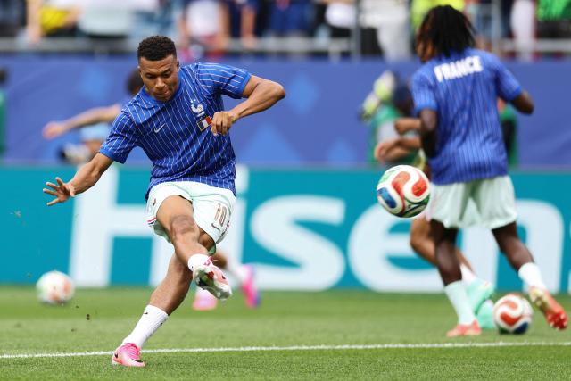 France's forward #10 Kylian Mbappe takes part in the warm-up ahead of the 2026 World Cup Group I football match between Norway and France at the Boston Stadium in Foxborough on June 26, 2026.  (Photo by CHARLY TRIBALLEAU / AFP)