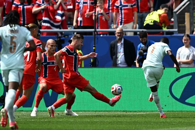 France's forward #07 Ousmane Dembele shoots and scores his team's first goal during the 2026 World Cup Group I football match between Norway and France at the Boston Stadium in Foxborough on June 26, 2026.  (Photo by Jewel SAMAD / AFP)