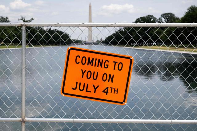 A sign is seen on a fence at the Reflecting Pool on the National Mall in Washington, DC, on June 26, 2026. US President Donald Trump on June 22 threatened jail time for anyone seeking to damage one of his signature renovation projects, the Reflecting Pool at the Lincoln Memorial in Washington, whose overhaul has become a political flashpoint. (Photo by SAUL LOEB / AFP)