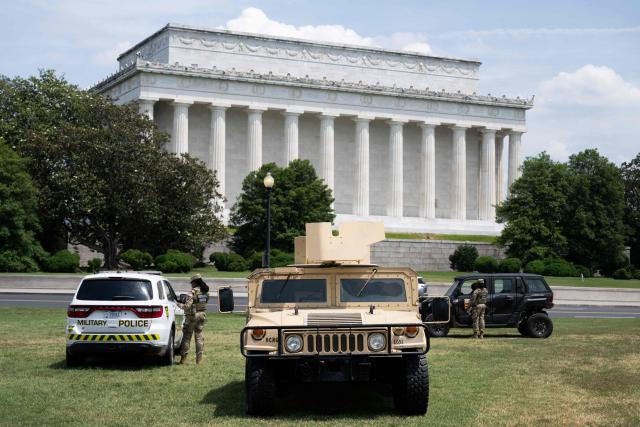 Members of the National Guard and a military vehicle patrol near the Lincoln Memorial on the National Mall in Washington, DC, on June 26, 2026. (Photo by SAUL LOEB / AFP)