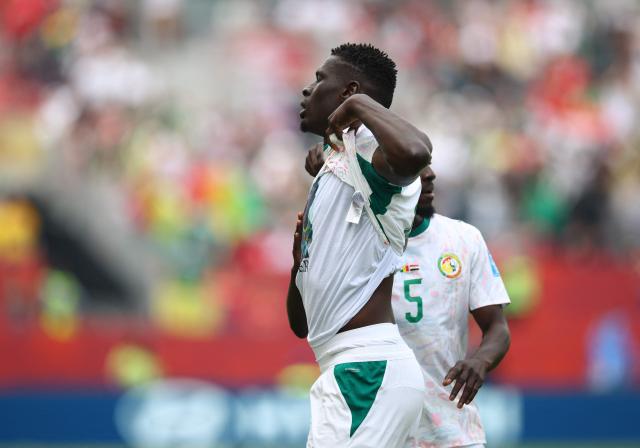 Senegal's defender #04 Abdoulaye Seck celebrates after scoring his team's first goal during the 2026 World Cup Group I football match between Senegal and Iraq at the Toronto Stadium in Toronto on June 26, 2026.  (Photo by Cole Burston / AFP)