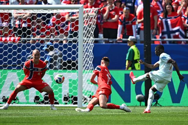 France's forward #07 Ousmane Dembele shoots and scores his team's third goal during the 2026 World Cup Group I football match between Norway and France at the Boston Stadium in Foxborough on June 26, 2026.  (Photo by Jewel SAMAD / AFP)