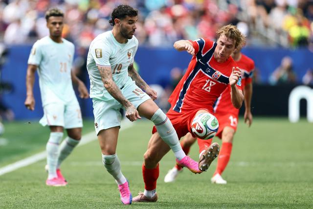 France's defender #19 Theo Hernandez and Norway's midfielder #18 Kristian Thorstvedt fight for the ball during the 2026 World Cup Group I football match between Norway and France at the Boston Stadium in Foxborough on June 26, 2026.  (Photo by CHARLY TRIBALLEAU / AFP)