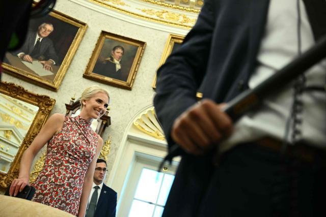 White House aide Natalie Harp is seen as US President Donald Trump presents findings of his Religious Liberty Commission in the Oval Office of the White House, in Washington, DC on June 26, 2026. (Photo by Kent NISHIMURA / AFP)