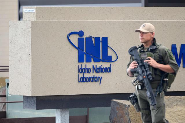 Armed guards look on at the Idaho National Laboratory in an area west of Idaho Falls, Idaho, on June 25, 2026. Several next-generation small nuclear reactors, widely seen as the future of the sector, are now operational or close to becoming so in the United States -- a major milestone made possible by an influx of private capital and support from the American government. The milestone was put on display in the middle of the Idaho dessert where a cluster of drab hangars might otherwise go unnoticed. (Photo by Josh Edelson / AFP)