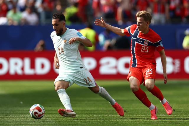 France's forward #24 Rayan Cherki and Norway's midfielder #23 Jens Petter Hauge fight for the ball during the 2026 World Cup Group I football match between Norway and France at the Boston Stadium in Foxborough on June 26, 2026.  (Photo by CHARLY TRIBALLEAU / AFP)