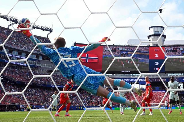 Norway's goalkeeper #13 Egil Selvik concedes a goal scored by France's forward #20 Desire Doue and his team fourth goal  during the 2026 World Cup Group I football match between Norway and France at the Boston Stadium in Foxborough on June 26, 2026.  (Photo by Jewel SAMAD / AFP)