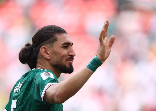 Iraq's defender #05 Hashim Akam Rahman greets fans after losing the 2026 World Cup Group I football match between Senegal and Iraq at the Toronto Stadium in Toronto on June 26, 2026.  (Photo by Cole Burston / AFP)
