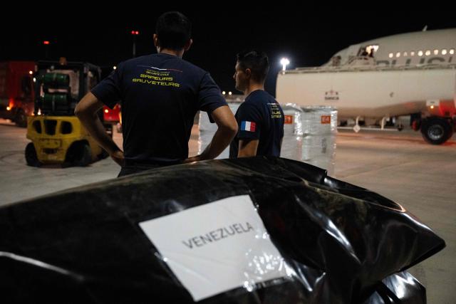 French officers of the 7e Régiment d'Instruction et d'Intervention de la Sécurité Civile (7e RIISC - The 7th Civil Security Training and Response Regiment) prepare their shipment before flying to Venezuela to provide help after two earthquakes hit the country, at the Marseille Provence Airport in Marignane, southern France, on June 26, 2026. The death toll from two powerful earthquakes that devastated Venezuela earlier this week rose to 920 on June 26, National Assembly President Jorge Rodriguez said. (Photo by Miguel MEDINA / AFP)
