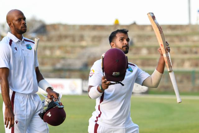Amir Jangoo (R) and Roston Chase (L) of West Indies walk off the field at the end of the 2nd day of the 1st Test between Sri Lanka and West Indies at Vivian Richards Cricket Stadium in North Sound, Antigua and Barbuda, on June 26, 2026. (Photo by Randy Brooks / AFP)