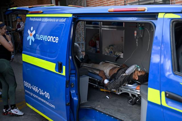 A young person is rushed into the Pariata Hospital in La Guaira state, Venezuela, on June 26, 2026, after being rescued from the rubble following deadly earthquakes. The death toll from two powerful earthquakes that devastated Venezuela earlier this week rose to 920 on June 26, National Assembly President Jorge Rodriguez said. (Photo by Federico PARRA / AFP)