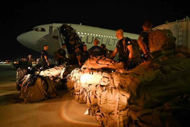 French officers of the 7e Régiment d'Instruction et d'Intervention de la Sécurité Civile (7e RIISC - The 7th Civil Security Training and Response Regiment) prepare their shipment before flying to Venezuela to provide help after two earthquakes hit the country, at the Marseille Provence Airport in Marignane, southern France, on June 27, 2026. The death toll from two powerful earthquakes that devastated Venezuela earlier this week rose to 920 on June 26, National Assembly President Jorge Rodriguez said. (Photo by Miguel MEDINA / AFP)