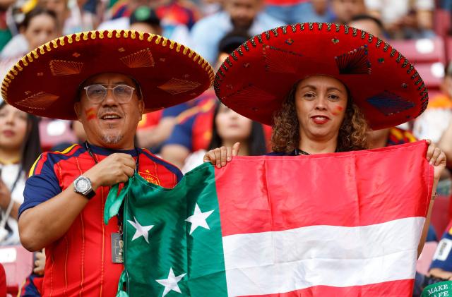 Spanish fans pose for a picture ahead of the 2026 World Cup Group H football match between Uruguay and Spain at the Guadalajara Stadium in Zapopan on June 26, 2026.  (Photo by Ulises RUIZ / AFP)