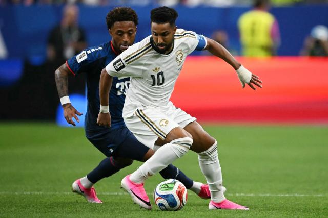 Cape Verde's forward #20 Ryan Mendes (L) and Saudi Arabia's forward #10 Salem Al-Dawsari compete for the ball during the 2026 World Cup Group H football match between Cape Verde and Saudi Arabia at the Houston Stadium in Houston on June 26, 2026.  (Photo by RONALDO SCHEMIDT / AFP)