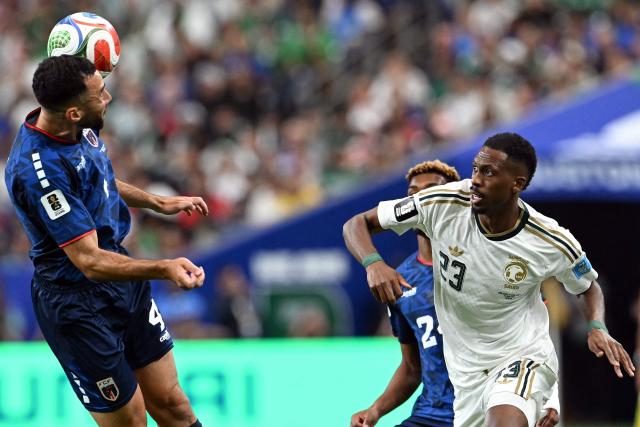 Cape Verde's defender #04 Pico Lopes (L) and Saudi Arabia's midfielder #23 Mohamed Kanno compete for the ball during the 2026 World Cup Group H football match between Cape Verde and Saudi Arabia at the Houston Stadium in Houston on June 26, 2026.  (Photo by RONALDO SCHEMIDT / AFP)