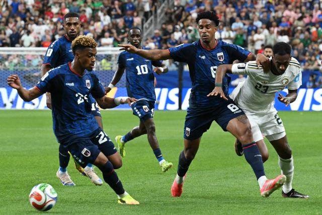 Cape Verde's defender #24 Wagner Pina (L) takes the ball as Cape Verde's defender #08 Joao Paulo is challenged by Saudi Arabia's midfielder #23 Mohamed Kanno during the 2026 World Cup Group H football match between Cape Verde and Saudi Arabia at the Houston Stadium in Houston on June 26, 2026.  (Photo by RONALDO SCHEMIDT / AFP)