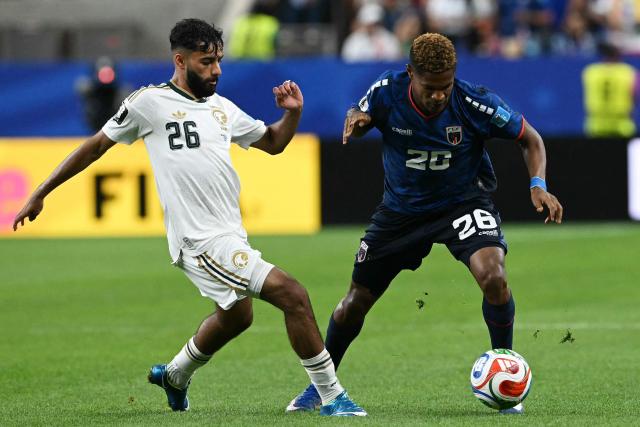 Saudi Arabia's defender #26 Mohammed Abu Al-Shamat (L) and Cape Verde's forward #26 Helio Varela compete for the ball during the 2026 World Cup Group H football match between Cape Verde and Saudi Arabia at the Houston Stadium in Houston on June 26, 2026.  (Photo by RONALDO SCHEMIDT / AFP)