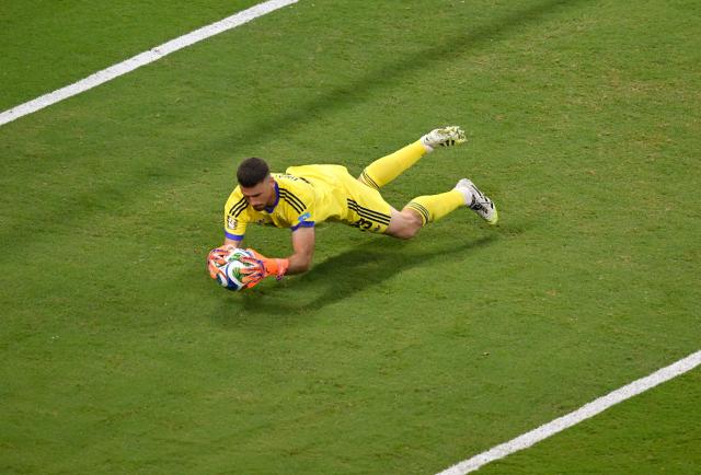 Spain's goalkeeper #23 Unai Simon makes a save during the 2026 World Cup Group H football match between Uruguay and Spain at the Guadalajara Stadium in Zapopan on June 26, 2026.  (Photo by Alfredo ESTRELLA / AFP)
