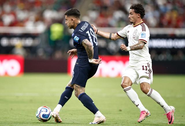 Uruguay's midfielder #18 Brian Rodriguez and Spain's forward #11 Yeremy Pino fight for the ball during the 2026 World Cup Group H football match between Uruguay and Spain at the Guadalajara Stadium in Zapopan on June 26, 2026.  (Photo by Ulises RUIZ / AFP)