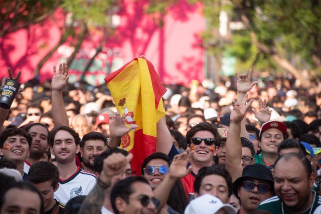 Fans react as they watch the 2026 World Cup Group H football match between Uruguay and Spain on a giant screen at the FIFA Fan Festival, held at Plaza de la Liberacion and Plaza de Armas, in Guadalajara, Mexico, on June 26, 2026. (Photo by RUTH ROSAS / AFP)