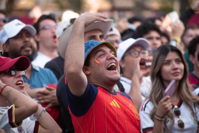 Fans react as they watch the 2026 World Cup Group H football match between Uruguay and Spain on a giant screen at the FIFA Fan Festival, held at Plaza de la Liberacion and Plaza de Armas, in Guadalajara, Mexico, on June 26, 2026. (Photo by RUTH ROSAS / AFP)