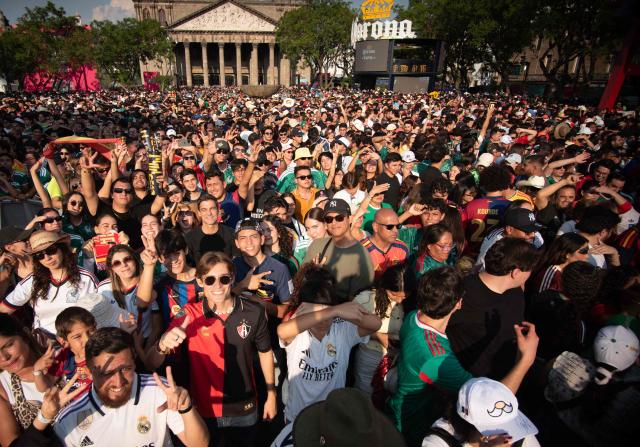 Fans watch the 2026 World Cup Group H football match between Uruguay and Spain on a giant screen at the FIFA Fan Festival, held at Plaza de la Liberacion and Plaza de Armas, in Guadalajara, Mexico, on June 26, 2026. (Photo by RUTH ROSAS / AFP)