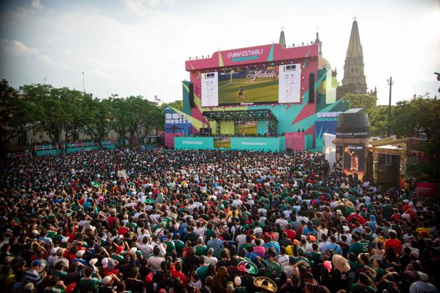 Fans watch the 2026 World Cup Group H football match between Uruguay and Spain on a giant screen at the FIFA Fan Festival, held at Plaza de la Liberacion and Plaza de Armas, in Guadalajara, Mexico, on June 26, 2026. (Photo by RUTH ROSAS / AFP)