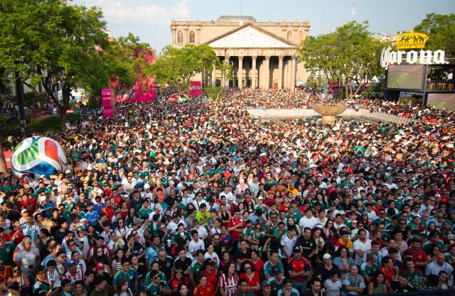 Fans watch the 2026 World Cup Group H football match between Uruguay and Spain on a giant screen at the FIFA Fan Festival, held at Plaza de la Liberacion and Plaza de Armas, in Guadalajara, Mexico, on June 26, 2026. (Photo by RUTH ROSAS / AFP)
