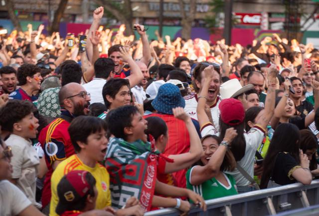 Fans react as they watch the 2026 World Cup Group H football match between Uruguay and Spain on a giant screen at the FIFA Fan Festival, held at Plaza de la Liberacion and Plaza de Armas, in Guadalajara, Mexico, on June 26, 2026. (Photo by RUTH ROSAS / AFP)