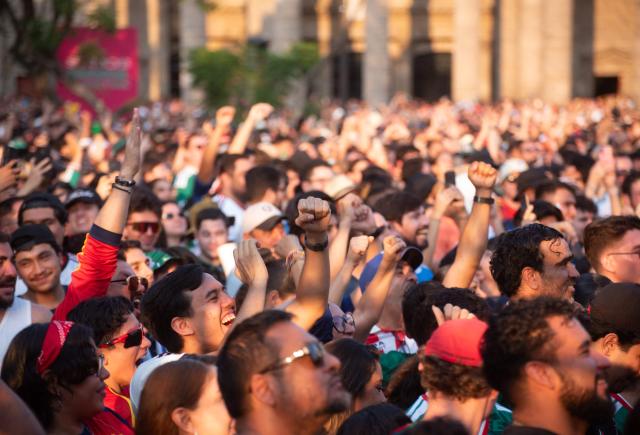 Fans react as they watch the 2026 World Cup Group H football match between Uruguay and Spain on a giant screen at the FIFA Fan Festival, held at Plaza de la Liberacion and Plaza de Armas, in Guadalajara, Mexico, on June 26, 2026. (Photo by RUTH ROSAS / AFP)